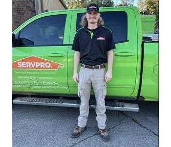 SERVPRO employee next to service truck